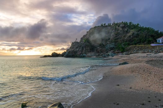 View of a peaceful sunset and waves on Shell Beach, Saint Barthélemy (St. Barts)