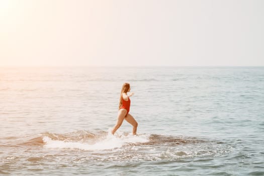 Woman sea yoga. Back view of free calm happy satisfied woman with long hair standing on top rock with yoga position against of sky by the sea. Healthy lifestyle outdoors in nature, fitness concept.