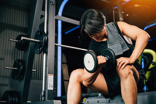 A fitness instructor holding a dumbbell, teaching people the importance of exercise and training for a healthy lifestyle and wellness. empty space