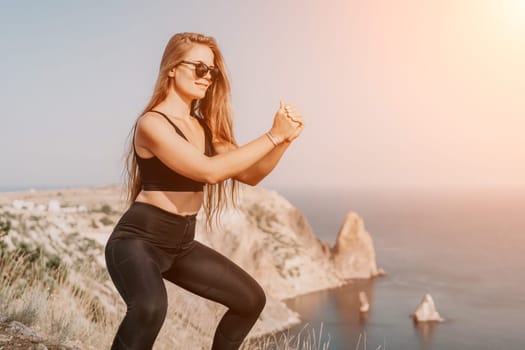 Fitness woman sea. Outdoor workout with fitness rubber bands in park over beach. Female fitness pilates yoga routine concept. Healthy lifestyle. Happy fit woman exercising with rubber band in park