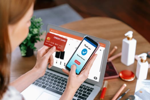 Woman shopping online on internet marketplace browsing for sale items for modern lifestyle and use credit card for online payment from wallet protected by utmost cyber security software