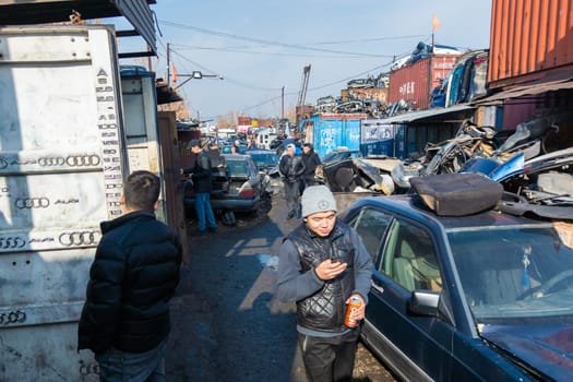 car parts at open air junkyard and used spare parts market in Kudaybergen, Bishkek, Kyrgyzstan - November 11, 2022