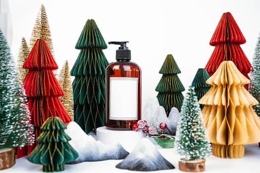 dark jar with dispenser on the background of Christmas decorations