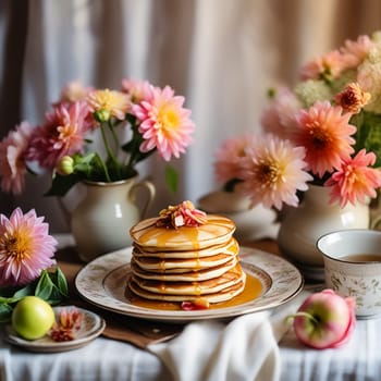Cozy Homemade Breakfast Pancakes with Apple Sauce, Vintage Dishes, and Dahlias Bouquet on a Retro Tablecloth