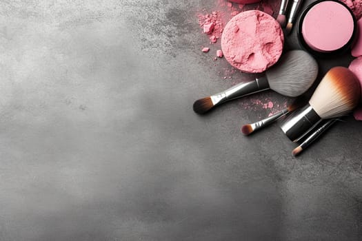 Various makeup products and brushes spread on a textured background