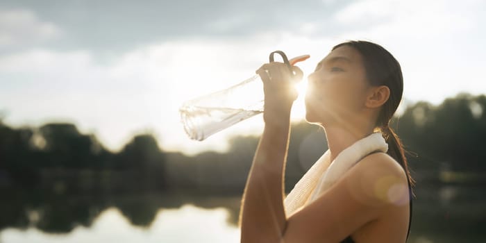 Drinking water, fitness and exercise woman after sports run and training in nature.