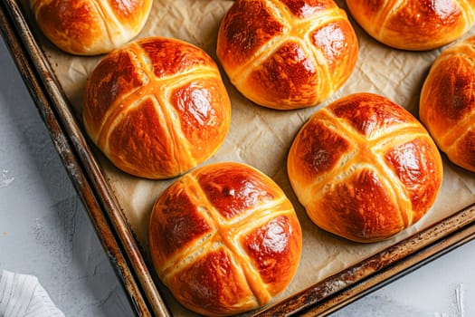 Traditional Easter hot cross buns on a baking tray. AI generated.