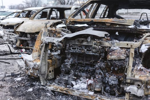 Kyiv, Ukraine - January 3, 2024: Burned civilians cars after a Russian's missiles attack.