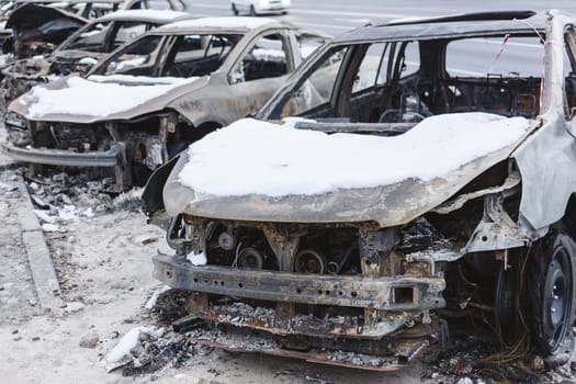 Kyiv, Ukraine - January 3, 2024: Burned civilians cars after a Russian's missiles attack.