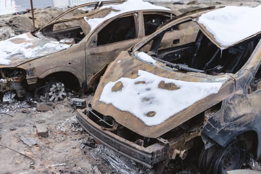 Kyiv, Ukraine - January 3, 2024: Burned civilians cars after a Russian's missiles attack.