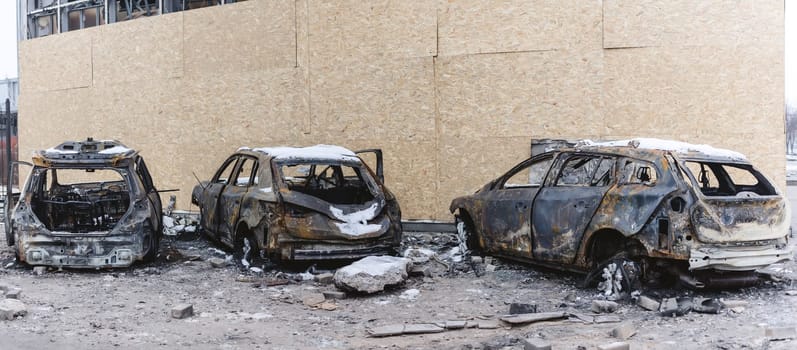 Kyiv, Ukraine - January 3, 2024: Burned civilians cars after a Russian's missiles attack.