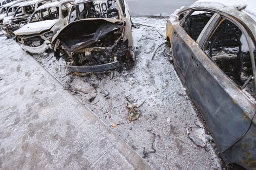 Kyiv, Ukraine - January 3, 2024: Burned civilians cars after a Russian's missiles attack.