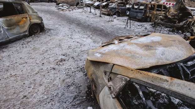 Kyiv, Ukraine - January 3, 2024: Burned civilians cars after a Russian's missiles attack.