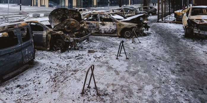 Kyiv, Ukraine - January 3, 2024: Burned civilians cars after a Russian's missiles attack.