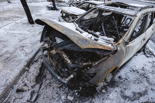 Kyiv, Ukraine - January 3, 2024: Burned civilians cars after a Russian's missiles attack.