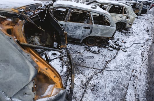 Kyiv, Ukraine - January 3, 2024: Burned civilians cars after a Russian's missiles attack.