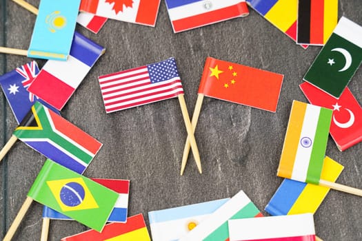 Policy. National flags of different countries. The concept is diplomacy. In the middle among the various flags are two flags - USA, China