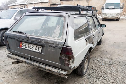 rear view of old beaten Volkswagen Passat B2 Variant with thick layer of putty and missing rear bumper on parking in Sokuluk. Kyrgyzstan: December 5, 2022