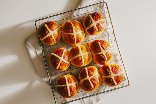 Traditional Easter hot cross buns on a cooling rack. AI generated.
