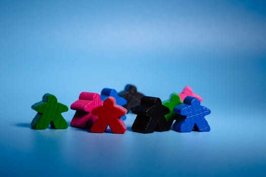 Group of Colorful Wooden Figures Sitting Together