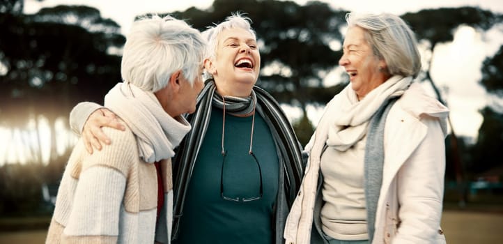 Talking, funny and senior woman friends outdoor in a park together for bonding during retirement. Happy, smile and laughing with a group of elderly people chatting in a garden for humor or fun.