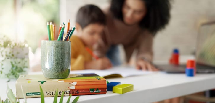Mom, child and help with homework, color pencil and drawing for education, learning and development. Homeschool, mother and kid with motivation, support and teaching for school project in family home.