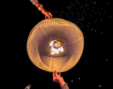 Sky lantern mass release event for Yee Peng and Loy Krathong festival in Chiang Mai, Thailand, south east asia