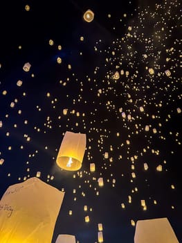 Sky lantern mass release event for Yee Peng and Loy Krathong festival in Chiang Mai, Thailand, south east asia