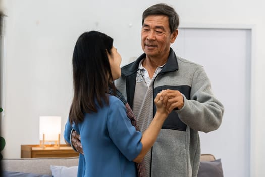 Holding hands, hug or happy old couple dancing for love, support or trust in marriage at home together.