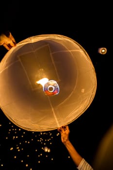 Sky lantern mass release event for Yee Peng and Loy Krathong festival in Chiang Mai, Thailand, south east asia