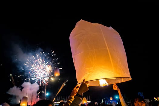 Sky lantern mass release event for Yee Peng and Loy Krathong festival in Chiang Mai, Thailand, south east asia