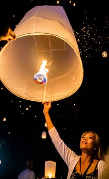 Sky lantern mass release event for Yee Peng and Loy Krathong festival in Chiang Mai, Thailand, south east asia