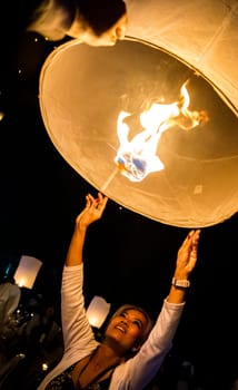 Sky lantern mass release event for Yee Peng and Loy Krathong festival in Chiang Mai, Thailand, south east asia