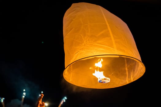 Sky lantern mass release event for Yee Peng and Loy Krathong festival in Chiang Mai, Thailand, south east asia