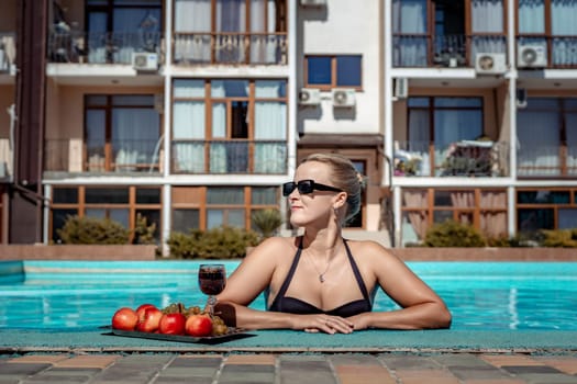 Bikini-clad woman enjoys poolside relaxation. Poolside ambiance. Capturing woman's relaxed time near pool