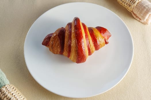 White Porcelain Platter, Adorned With a Juicy Croissant Crimson Strawberry.