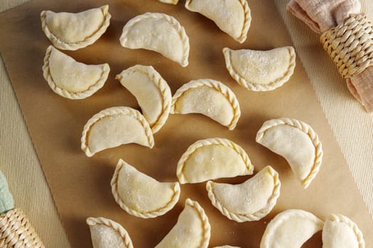 Variety of beautifully crafted dumplings artfully assembled on a wooden cutting board