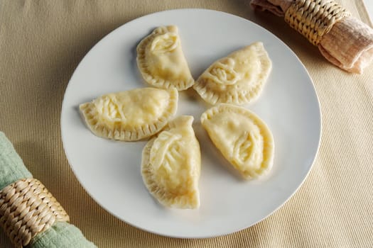 Delectable Crescent Dumplings on a Plate: A Culinary Snapshot