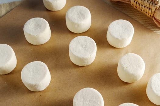 Pristine Mounds: A Flourish of White Dough Effortlessly Resides on a Polished Table