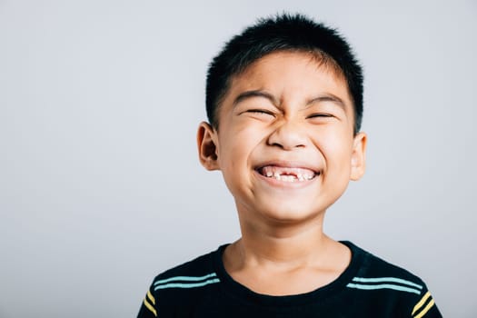 Child wide smile reveals gap from missing upper tooth. Dental development isolated on white. Tooth loss joyful growth tooth fairy moment. Children show teeth new gap, dentist problems