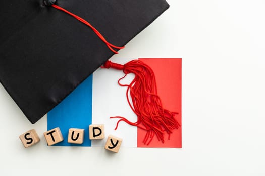 Graduation Cap with wooden cubes Isolated on White Background. High quality photo