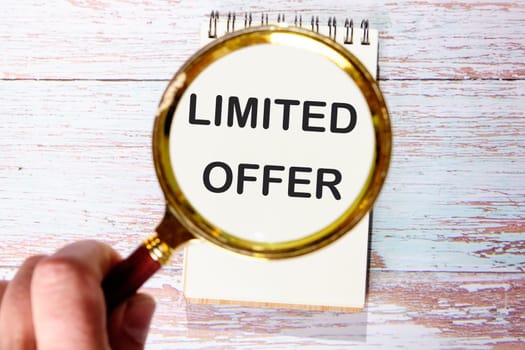 Limited offer text through a magnifying glass