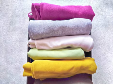 Tidy and organized clothes with the konmari method. Storage of T-shirts folded in box