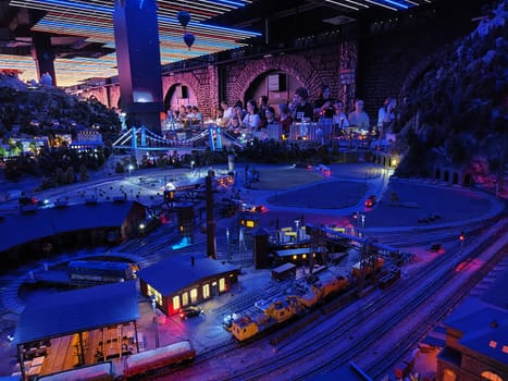 Saint-Petersburg, Russia - August 03, 2023: grand project Russia. Layout of city, country, street, landscape with small toy people, houses, roads, cars, nature and visitors tourists in the museum