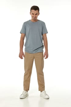 annoyed angry man standing on white studio background