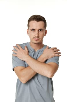 portrait of young funny man grimacing on white background