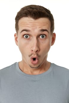 surprised guy looking at camera on white studio background