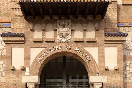 Malaga, Spain- 26-01-2024: Entrance of Universidad de Malaga with traditional brickwork, perfect for educational themes or Spanish architecture. The University of Malaga