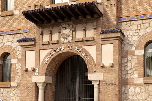 Malaga, Spain- 26-01-2024: Entrance of Universidad de Malaga with traditional brickwork, perfect for educational themes or Spanish architecture. The University of Malaga