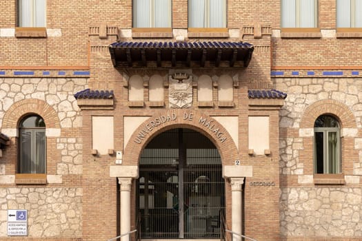 Malaga, Spain- 26-01-2024: Entrance of Universidad de Malaga with traditional brickwork, perfect for educational themes or Spanish architecture. The University of Malaga